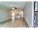Bright open-concept living space with hardwood floors flowing seamlessly into the modern kitchen at 3855 Shelleydale Dr, Powder Springs, GA 30127