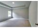 Spacious main bedroom with tray ceiling, plush carpet, and lots of space at 3855 Shelleydale Dr, Powder Springs, GA 30127