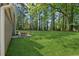 Lush backyard with expansive lawn space is perfect for entertaining or relaxing at 4147 Pinehurst Valley Dr, Decatur, GA 30034