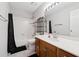 Bright bathroom boasts a tub with shower, cabinet vanity, and neutral finishes at 4147 Pinehurst Valley Dr, Decatur, GA 30034