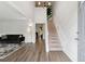 Bright foyer features high ceilings, a staircase, and wood flooring leading into the living area at 4147 Pinehurst Valley Dr, Decatur, GA 30034