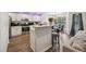 Stylish kitchen featuring stainless steel appliances, white cabinets, and an adjacent dining area at 4147 Pinehurst Valley Dr, Decatur, GA 30034