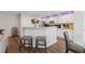 Modern kitchen with white cabinetry, barstool seating at peninsula, and stainless appliances at 4147 Pinehurst Valley Dr, Decatur, GA 30034