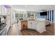 Open concept kitchen with white cabinetry, granite countertops, and stainless steel appliances at 4147 Pinehurst Valley Dr, Decatur, GA 30034