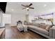 Spacious living room with hardwood floors, modern furniture, and access to other rooms at 4147 Pinehurst Valley Dr, Decatur, GA 30034