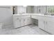 Bathroom with vanity, marble floors, and plenty of storage at 4147 Pinehurst Valley Dr, Decatur, GA 30034