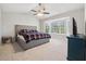 Primary bedroom with a large bed, bay window, and a neutral color scheme at 4147 Pinehurst Valley Dr, Decatur, GA 30034