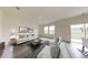 Bright living room features neutral decor, plush seating, and large windows for an inviting atmosphere at 7763 Sudbury Cir, Covington, GA 30014