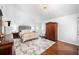 Cozy bedroom with vaulted ceiling, hardwood floors, and stylish decor at 8885 N Mount Dr, Johns Creek, GA 30022