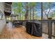 View of deck with outdoor seating and grill, perfect for outdoor entertaining at 8885 N Mount Dr, Johns Creek, GA 30022