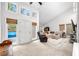 Spacious living room features high ceilings, large windows, and neutral decor at 8885 N Mount Dr, Johns Creek, GA 30022