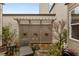 Landscaped backyard with a decorative privacy screen and a tranquil seating area at 115 Batten Board Way Way, Woodstock, GA 30189