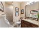 Elegant bathroom with granite countertops, tile shower, and decorative accents at 115 Batten Board Way Way, Woodstock, GA 30189