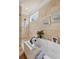 Close up of soaking tub and walk-in shower in a bathroom with tiled walls and floors at 115 Batten Board Way Way, Woodstock, GA 30189