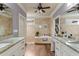 Large bathroom with dual vanities, granite countertops, tiled floors, soaking tub and walk-in shower at 115 Batten Board Way Way, Woodstock, GA 30189