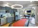 Clubhouse featuring a kitchenette, billiards table, stone fireplace, and large windows, providing a comfortable community space at 115 Batten Board Way Way, Woodstock, GA 30189