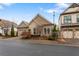 Home featuring stone accents and a brick driveway nestled within a community at 115 Batten Board Way Way, Woodstock, GA 30189