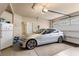 Well-lit garage with a silver sedan, ample storage space, and a clean, organized appearance at 115 Batten Board Way Way, Woodstock, GA 30189