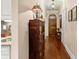 Elegant hallway features hardwood floors and a decorative chandelier at 115 Batten Board Way Way, Woodstock, GA 30189