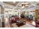 Living room with a coffered ceiling, and the kitchen and dining room in view at 115 Batten Board Way Way, Woodstock, GA 30189