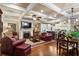 Open-concept living room with fireplace and coffered ceilings at 115 Batten Board Way Way, Woodstock, GA 30189