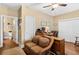 Home office featuring hardwood floors, natural light, and neutral paint with an en suite bathroom at 115 Batten Board Way Way, Woodstock, GA 30189