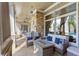 Inviting outdoor patio with stone fireplace and comfortable seating, perfect for relaxing and entertaining guests at 115 Batten Board Way Way, Woodstock, GA 30189