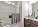 Well-appointed bathroom featuring a glass-enclosed shower and granite countertop at 2021 Adam Acres Dr, Lawrenceville, GA 30043