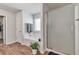 Bright bathroom featuring a shower, bathtub, and wood-look flooring at 2021 Adam Acres Dr, Lawrenceville, GA 30043