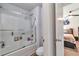 Bathroom boasting a glass-enclosed shower over tub and a toilet at 2021 Adam Acres Dr, Lawrenceville, GA 30043