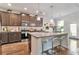 Modern kitchen featuring a center island, stainless steel appliances, and granite countertops at 2021 Adam Acres Dr, Lawrenceville, GA 30043