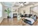 Inviting living room with coffered ceiling, hardwood floors, fireplace, and comfortable seating at 2021 Adam Acres Dr, Lawrenceville, GA 30043