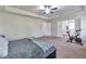 Expansive main bedroom with tray ceilings offers plenty of room for a home gym at 2021 Adam Acres Dr, Lawrenceville, GA 30043