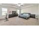 Spacious main bedroom with large windows, neutral colors, and a tray ceiling at 2021 Adam Acres Dr, Lawrenceville, GA 30043