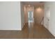 Hallway with hardwood floors and multiple doors at 250 Mooney Rd, Woodstock, GA 30188