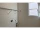 Laundry room with shelving and window at 250 Mooney Rd, Woodstock, GA 30188