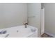 Relaxing bathroom featuring a soaking tub, separate shower, and neutral color scheme for a spa-like experience at 85 Emily Trce, Covington, GA 30016