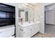 Stylish bathroom with white vanity, modern fixtures, and a built-in shelf for storage and organization at 85 Emily Trce, Covington, GA 30016
