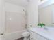 Well lit bathroom with shower-tub combo and vanity with white countertop at 85 Emily Trce, Covington, GA 30016