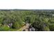 High angle view featuring homes surrounded by mature trees in a serene neighborhood at 104 Kremer Falls Trce, Canton, GA 30114