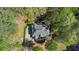 Aerial view of the house and property showing a treelined lot at 104 Kremer Falls Trce, Canton, GA 30114