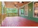 View of the back porch with ceiling fans and wooden floor at 104 Kremer Falls Trce, Canton, GA 30114