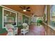 Comfortable back porch with ceiling fans and outdoor seating overlooking a lush green landscape at 104 Kremer Falls Trce, Canton, GA 30114