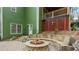 Outdoor fire pit with stone seating area in a landscaped backyard at 104 Kremer Falls Trce, Canton, GA 30114