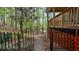 Backyard stone path and gate that provide access to a wooded area for a serene, private feel at 104 Kremer Falls Trce, Canton, GA 30114