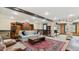 Finished basement with exposed brick, built-in bookcases, and a comfortable seating area at 104 Kremer Falls Trce, Canton, GA 30114