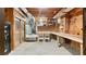 Utility basement area with a work bench, shelving, and exterior access, offering functional space at 104 Kremer Falls Trce, Canton, GA 30114