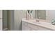 Well-lit bathroom showcasing a white vanity with a large mirror, modern faucet, and decorative accents at 104 Kremer Falls Trce, Canton, GA 30114