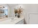 Elegant bathroom vanity featuring modern faucet, decorative accents, and a partial view into an office at 104 Kremer Falls Trce, Canton, GA 30114