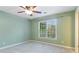 Light-filled bedroom with neutral carpet, fresh paint, large window, and modern ceiling fan at 104 Kremer Falls Trce, Canton, GA 30114